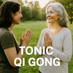 Two women concluding a Qi Gong session in a park, one thanking the other, who appears calm and radiant
